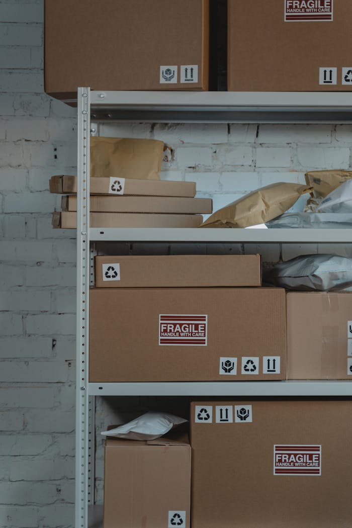 Brown Cardboard Boxes on a Steel Shelf